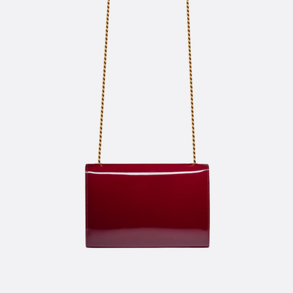 Petit sac SL Kate porté à l’épaule en cuir verni