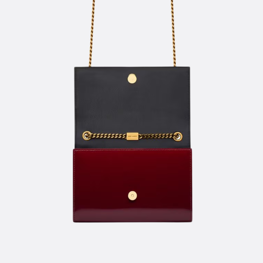 Petit sac SL Kate porté à l’épaule en cuir verni