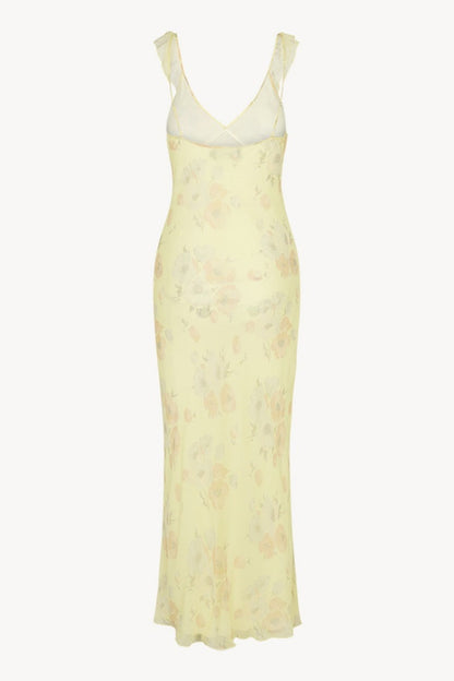 Vestido largo ajustado con cuello pronunciado y volantes con lazo y estampado floral